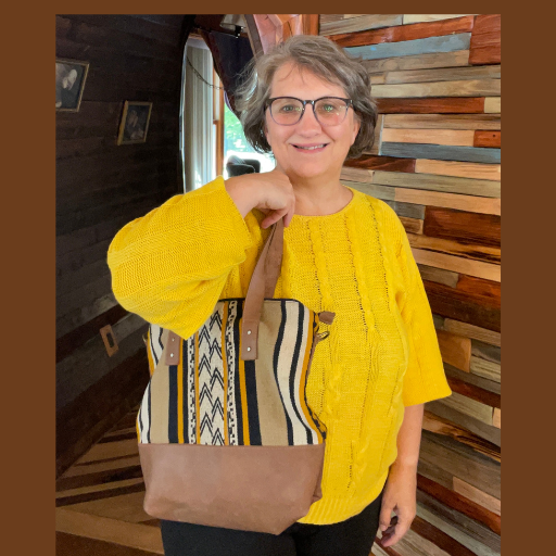 Laura Kulp Modeling the Dora Award 2023 a leather wool bag