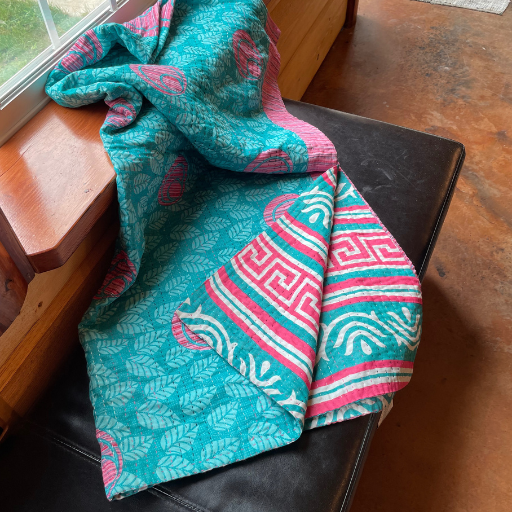 teal and pink blanket
